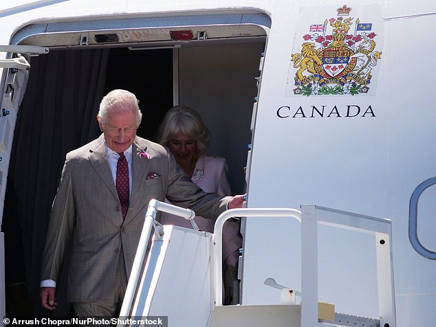 Charles and Camilla were greeted with shouts of 'welcome home' as they stepped off their plane which had travelled from the UK