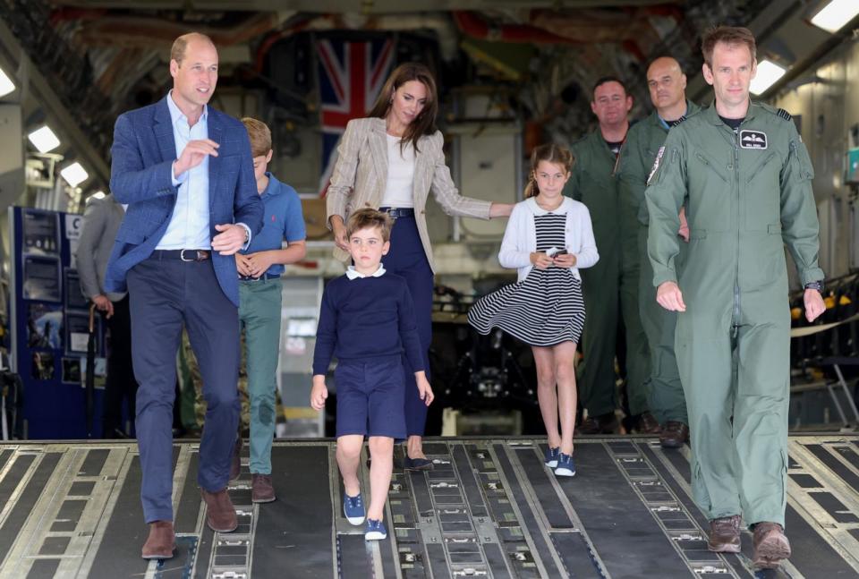 PHOTO: Prince William, Prince of Wales and Catherine, Princess of Wales with Prince George of Wales, Princess Charlotte of Wales and Prince Louis of Wales walk down the ramp at RAF Fairford, July 14, 2023, in Fairford, England. (Chris Jackson/Getty Images)