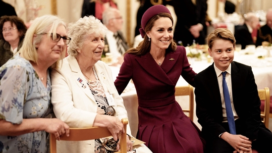 Britain's Catherine, Princess of Wales (2nd R) and Britain's Prince George of Wales (R) pose for pictures during a tea party for Second World War veterans at Buckingham Palace on May 5, 2025 to celebrate the 80th anniversary of VE Day also known as Victory in Europe Day, marking the end of the Second World War in Europe. (AFP)