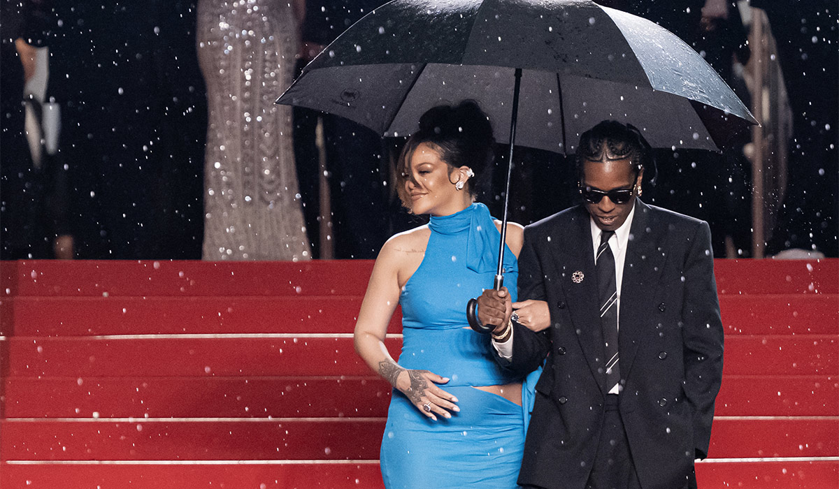Barbadian singer and actress Rihanna and US actor and singer Asap Rocky shelter from the rain with an umbrella as they leave after the screening of the film "Highest 2 Lowest" at the 78th edition of the Cannes Film Festival in Cannes. Pic: Getty Images
