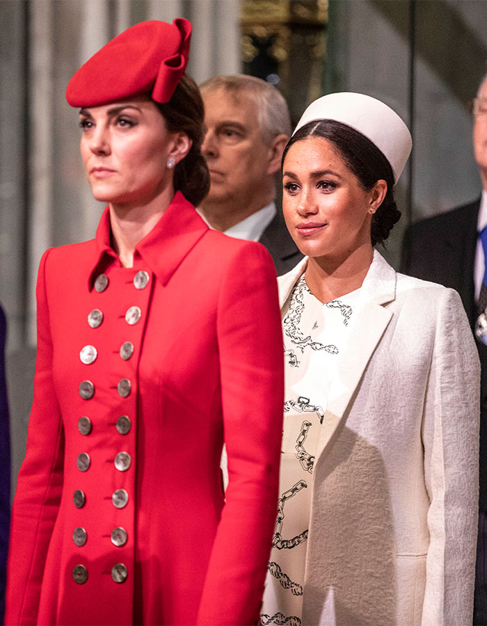 Kate Middleton wearing red coat and hat with Meghan Markle in white coat and hat at a formal event, highlighting clash details revealed. Kate Middleton wearing red coat and hat with Meghan Markle in white coat and hat at a formal event, highlighting clash details revealed.