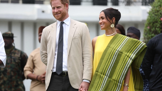 Prince Harry and Meghan Markle blasted for ‘taking advantage’ while royals are unable to conduct overseas tours (Photo by Kola SULAIMON / AFP)(AFP)