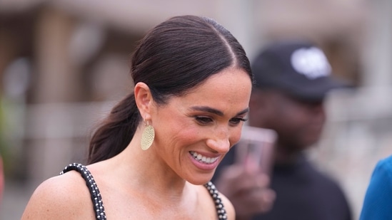 Meghan Markle seeks luxurious remote island retreat for family vacation. (AP Photo/Sunday Alamba)(AP)