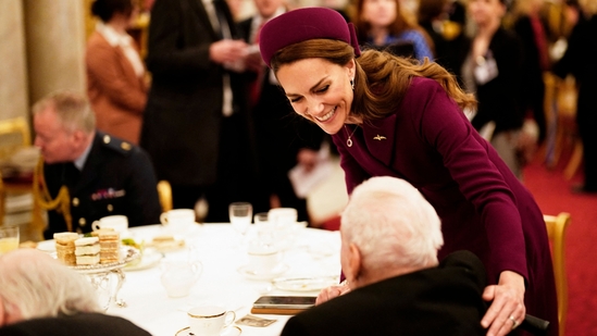 Britain's Catherine, Princess of Wales (rear) speaks with a Second World War veteran during a tea party at Buckingham Palace on May 5, 2025 to celebrate the 80th anniversary of VE Day also known as Victory in Europe Day, marking the end of the Second World War in Europe. (AFP)