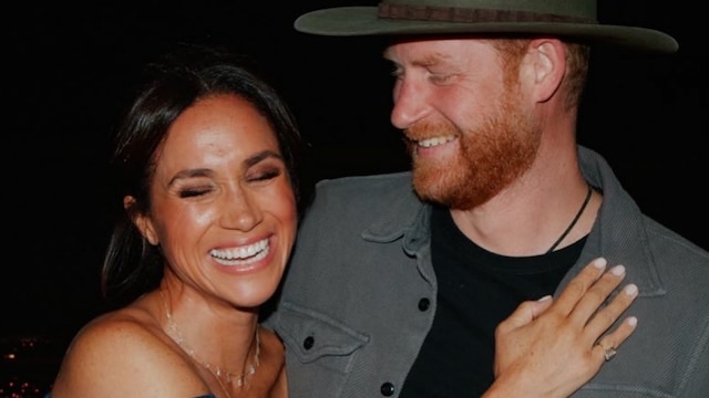 Meghan was also seen dancing while wearing Harry’s hat.
