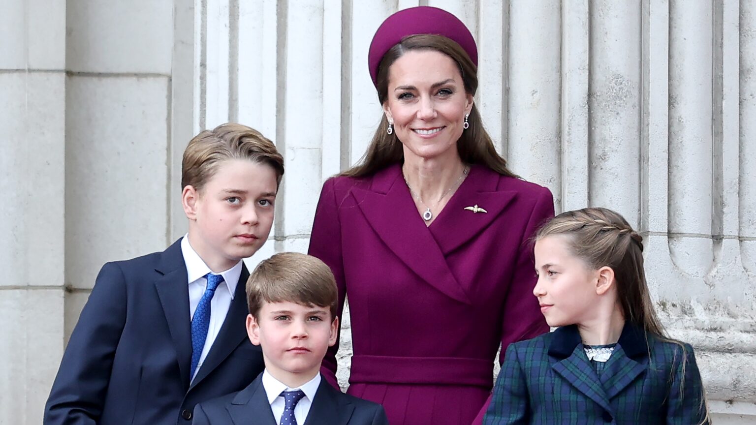 Prince George of Wales, Prince Louis of Wales, Catherine, Princess of Wales and Princess Charlotte of Wales watch the fly-past on the balcony of Buckingham Palace