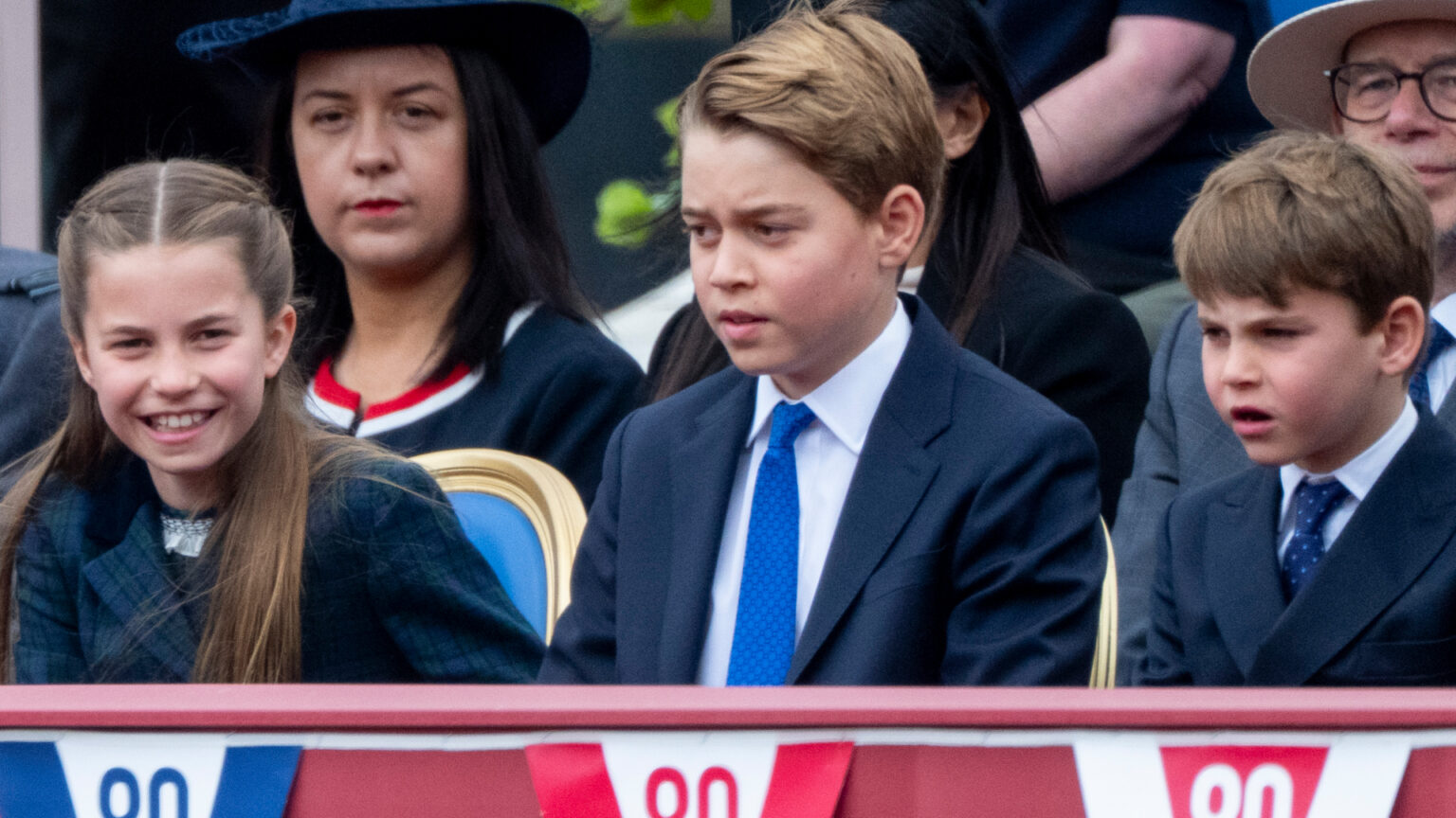 Prince Louis Gives His Unfiltered Review of VE Day Celebrations With Princess Charlotte and Prince George Princess Charlotte, Prince George and Prince Louis sitting next to each other at the VE Day 80 parade