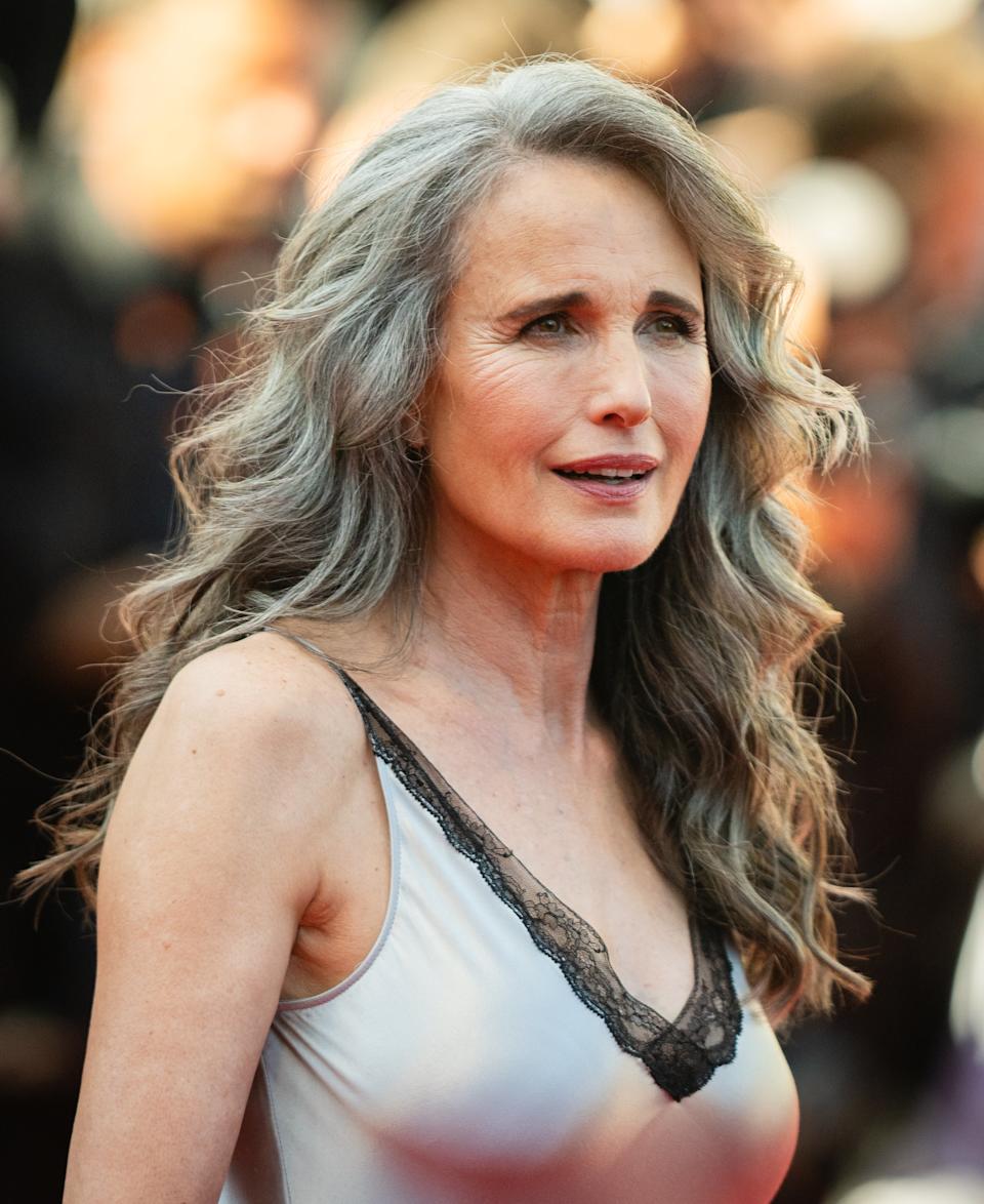 Andie MacDowell standing on a red carpet