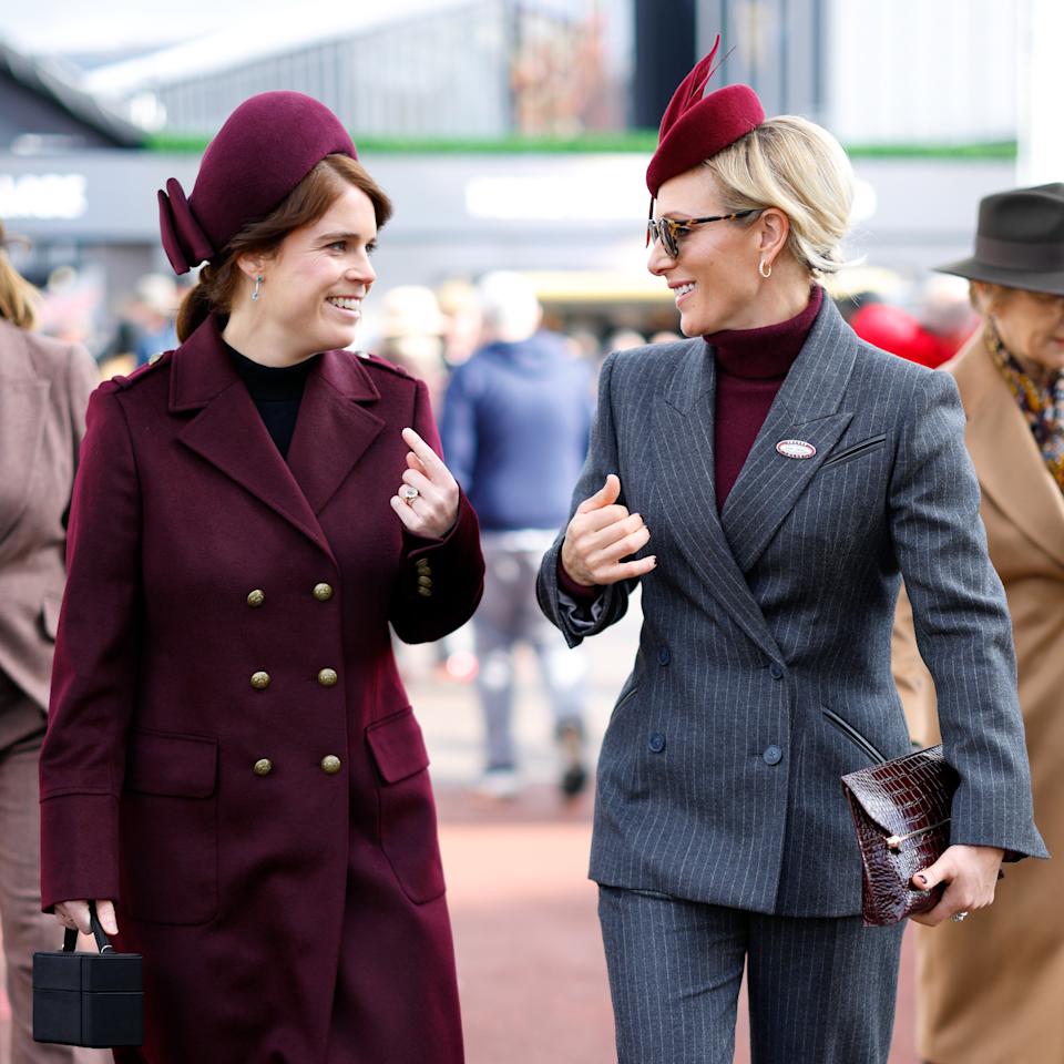 Zara Tindall and Princess Eugenie walking next to each other smiling 