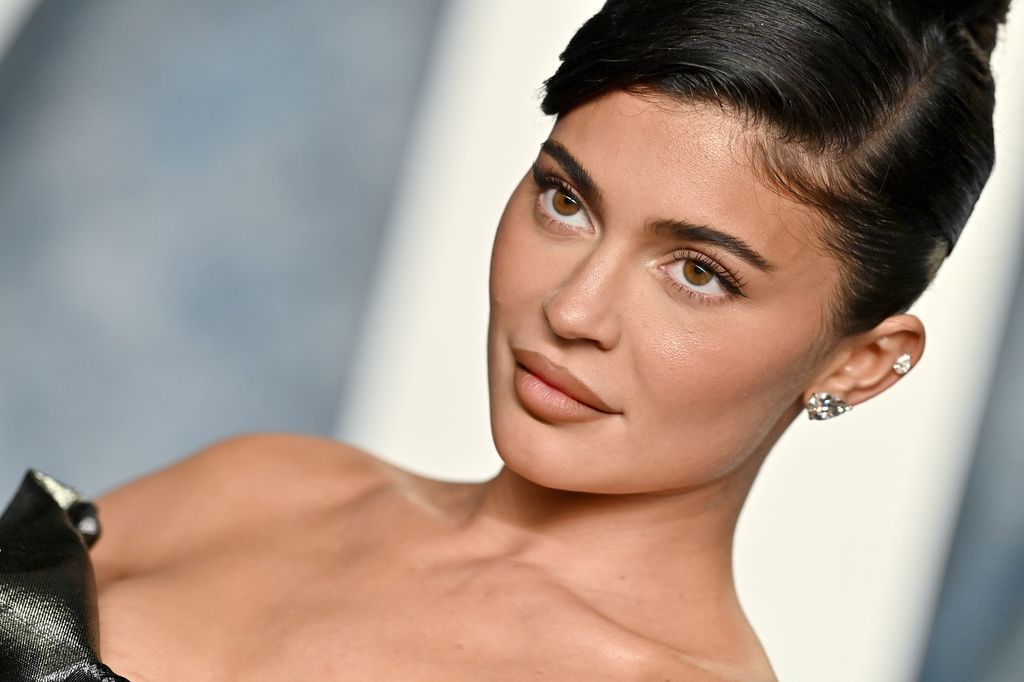 Headshot image of Kylie Jenner looking towards camera while posing at the Vanity Fair Oscars party