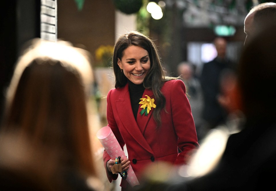 Catherine, Princess of Wales, smiling at a market.