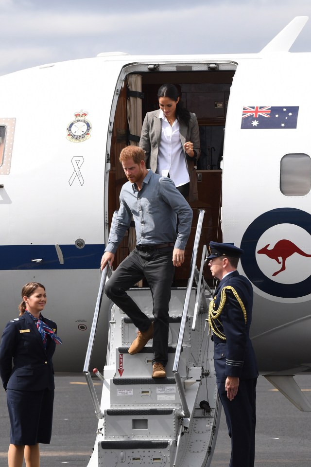 Prince Harry and Meghan Markle disembarking a plane.