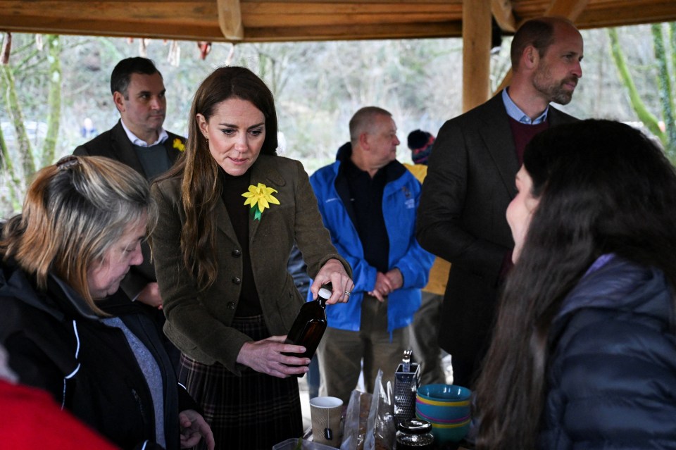 Prince William and Catherine, Princess of Wales, visiting a community garden.