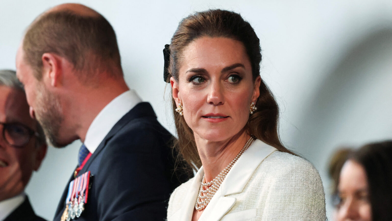 Kate Middleton Subtly Honors Holocaust Victims with Her Jewelry at VE Day Concert Kate Middleton wearing a white tweed blazer dress and pearl necklace at a VE Day anniversary concert