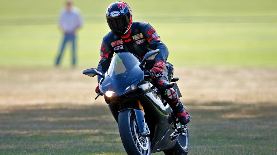 Prince William departs, riding his Ducati 1198S motorbike, after playing in the Westbury Shield charity polo match in 2009