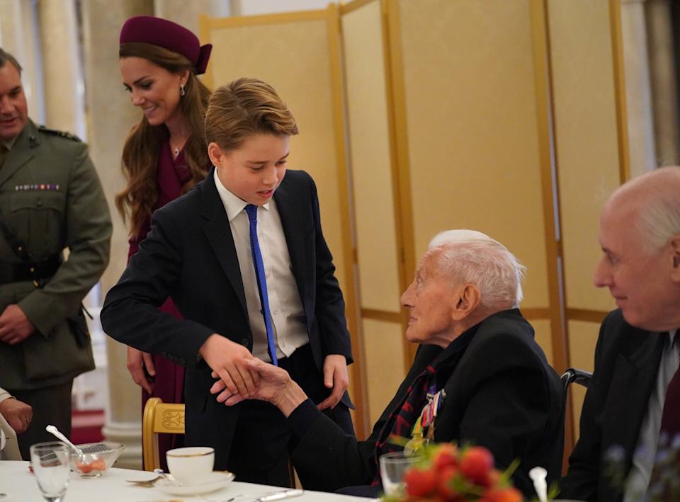 Prince George shaking hands with a war veteran