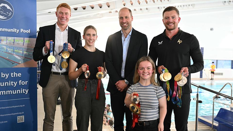 Prince William, Prince of Wales, poses for a picture with British Olympians and Paralympians Adam Peaty (R), Tom Dean (L), Maisie Summers-Newton (front R) and Louise Fiddes (2nd L) during a meeting with Olympians and Paralympians at the start of his visit to Birtley Community Pool 