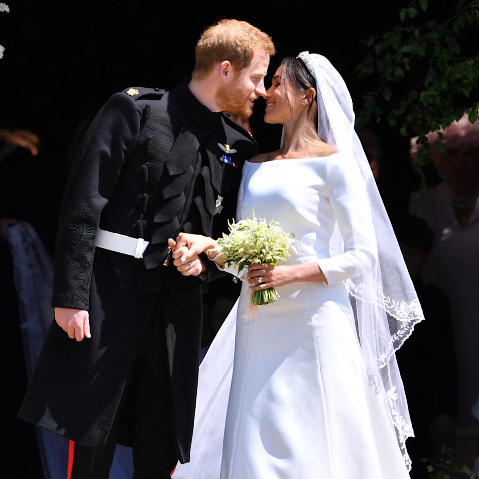  Prince Harry and Meghan Markle kissing on their wedding day. 