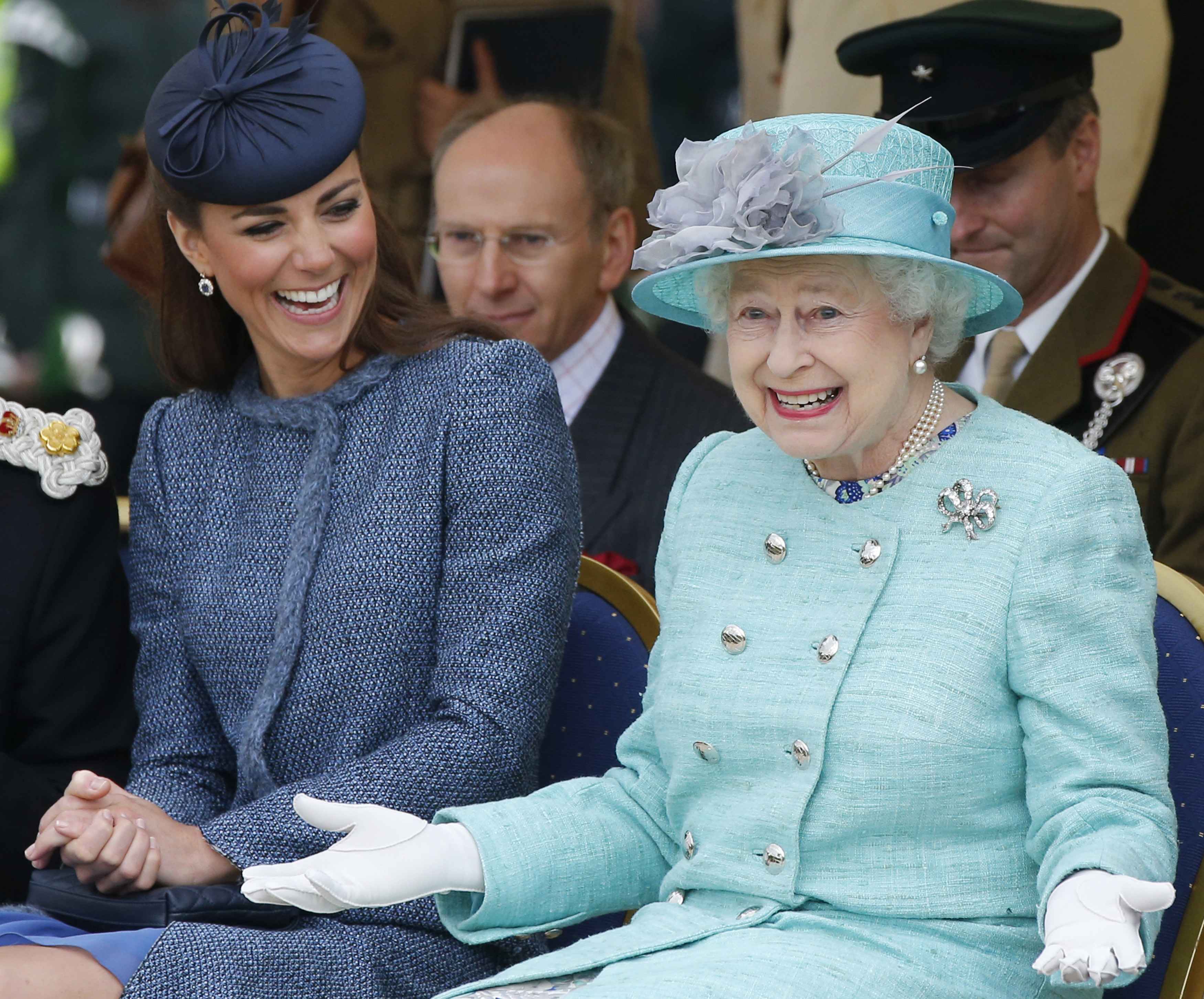 Kate Middleton, then-Duchess of Cambridge and Queen Elizabeth II watch part of a children's sports event while visiting Vernon Park during a Diamond Jubilee visit to Nottingham on June 13, 2012 in Nottingham, England