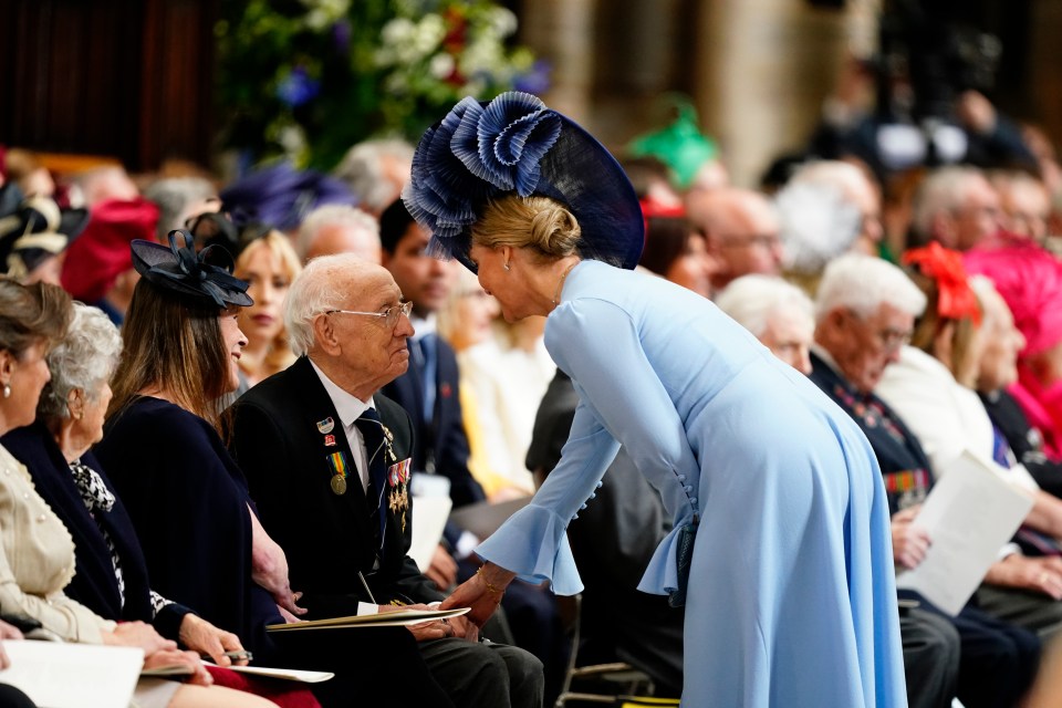 The Duchess of Edinburgh speaking with a veteran at a VE Day service.