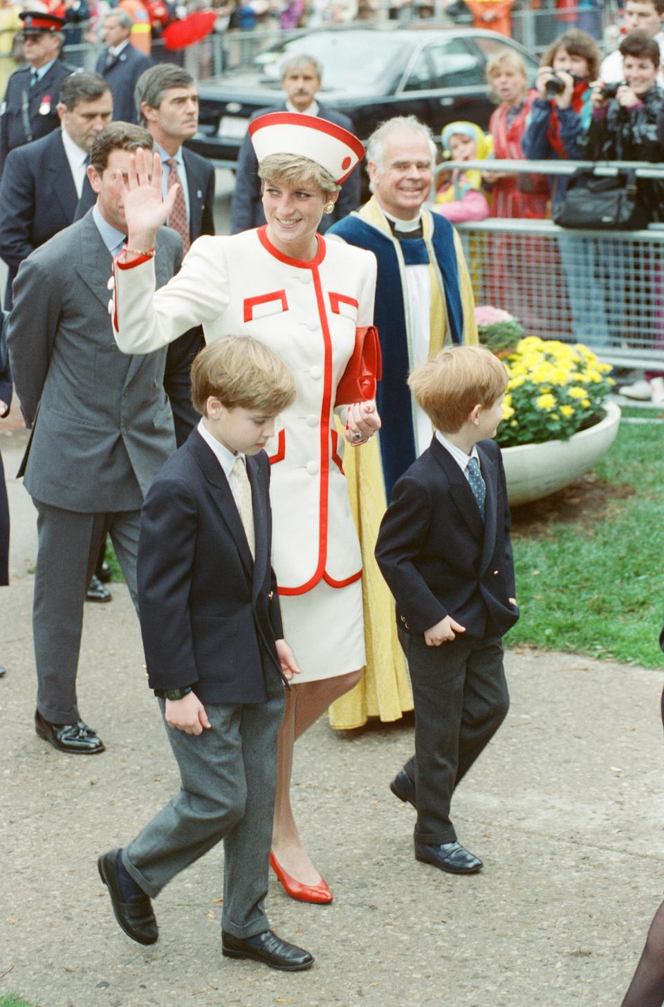 Princess Diana, Princess of Wales, with her sons William and Harry on a walkabout after church service at St. James Cathedral in Toronto, Canada. Prince Charles walks just behind in his grey suit. Picture taken 27th October, 1991. (Photo by Kent Gavin/Mirrorpix/Getty Images)