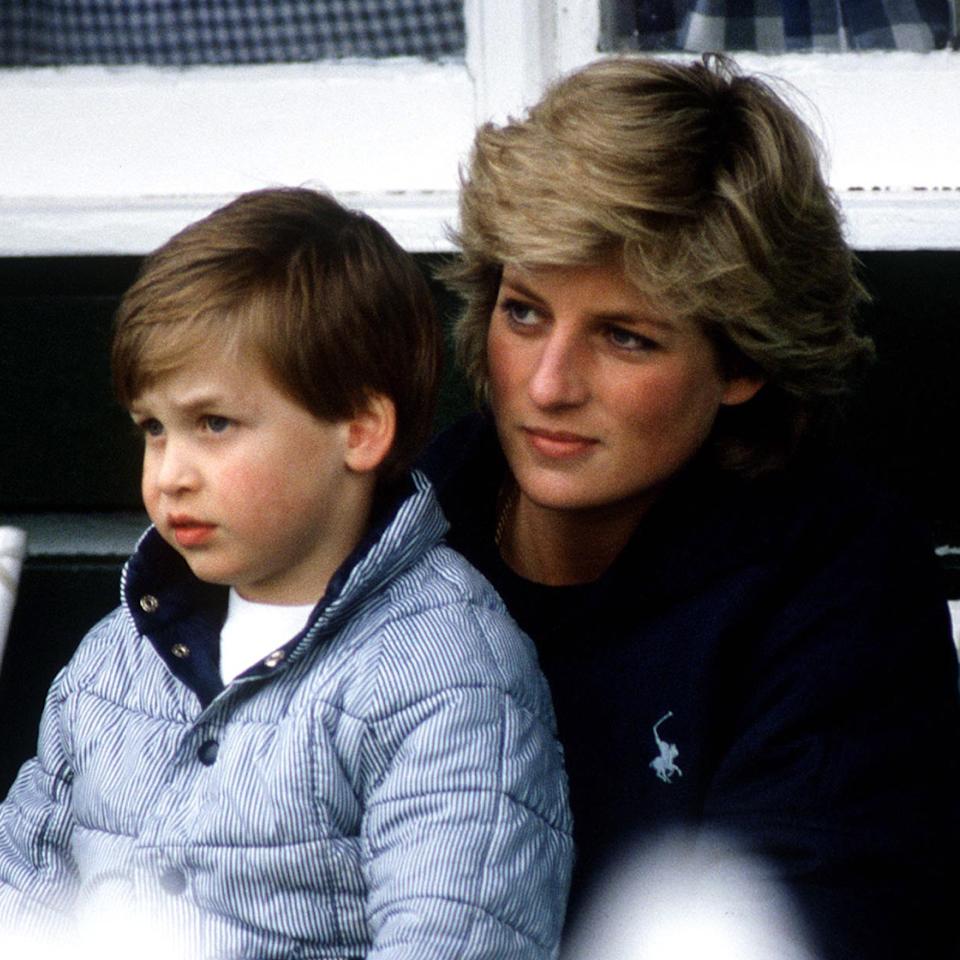 Prince William sits on Princess Diana's lap in 1987.