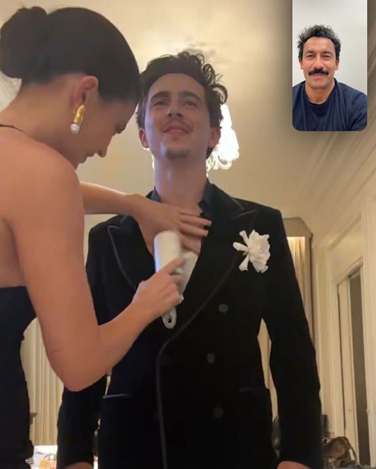 person getting dressed with assistance via video call
