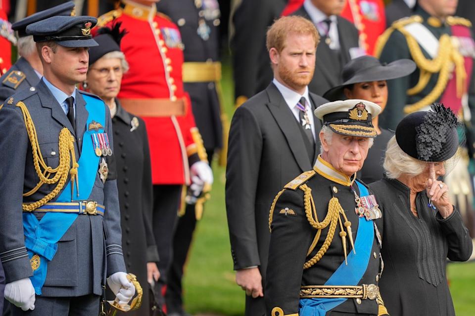FILE – King Charles III, from right, Camilla, the Queen Consort, Meghan, Duchess of Sussex, Prince Harry and Prince William watch as the coffin of Queen Elizabeth II is placed into the hearse following the state funeral service in Westminster Abbey in central London on Sept. 19, 2022. Prince Harry has said he wants to have his father and brother back and that he wants “a family, not an institution” during a TV interview ahead of the publication of his memoir. The interview with Britain’s ITV channel is due to be released this Sunday. (AP Photo/Martin Meissner, Pool, File)