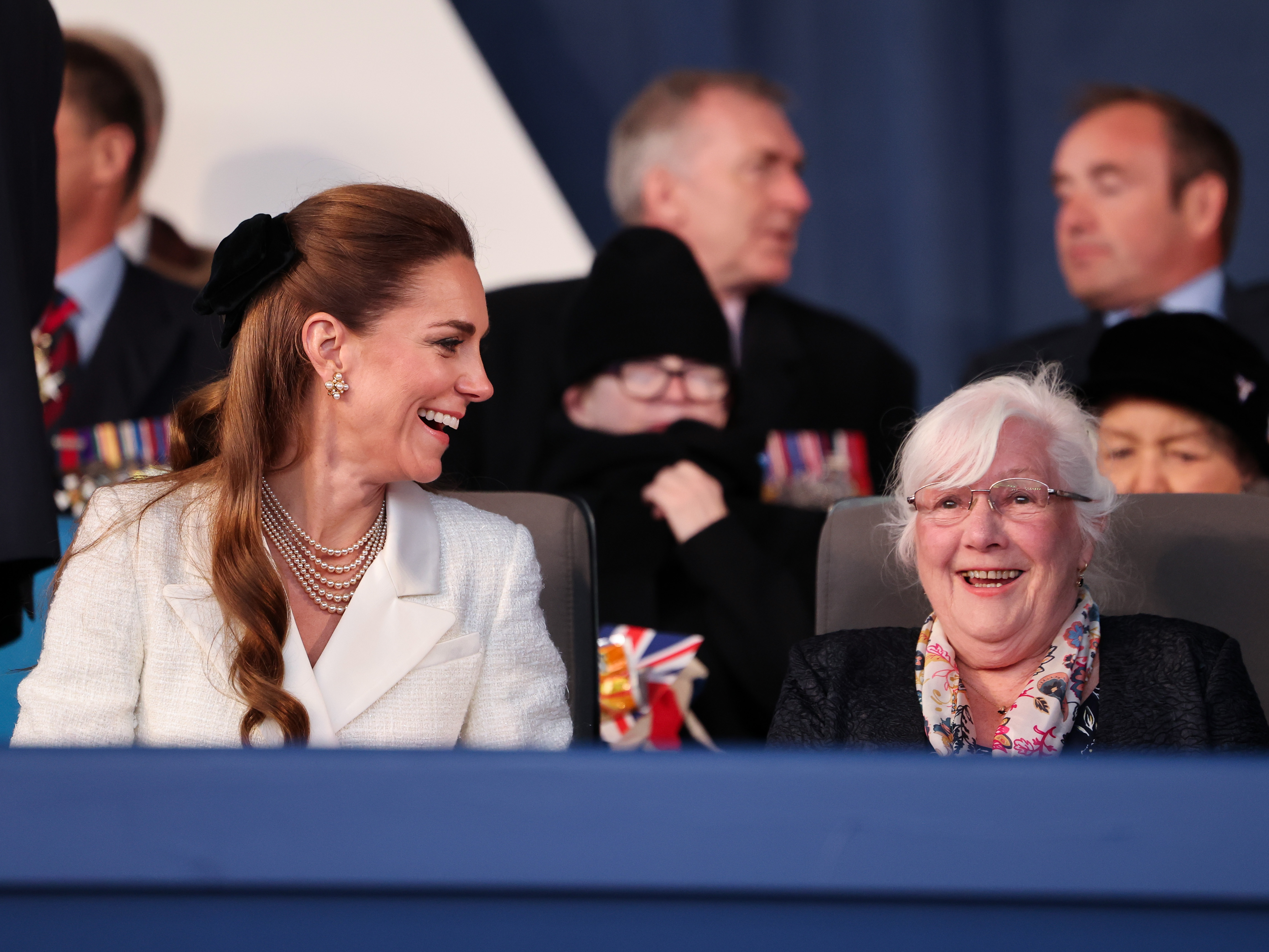 Kate Middleton laughing and talking to a woman at the VE Day concert