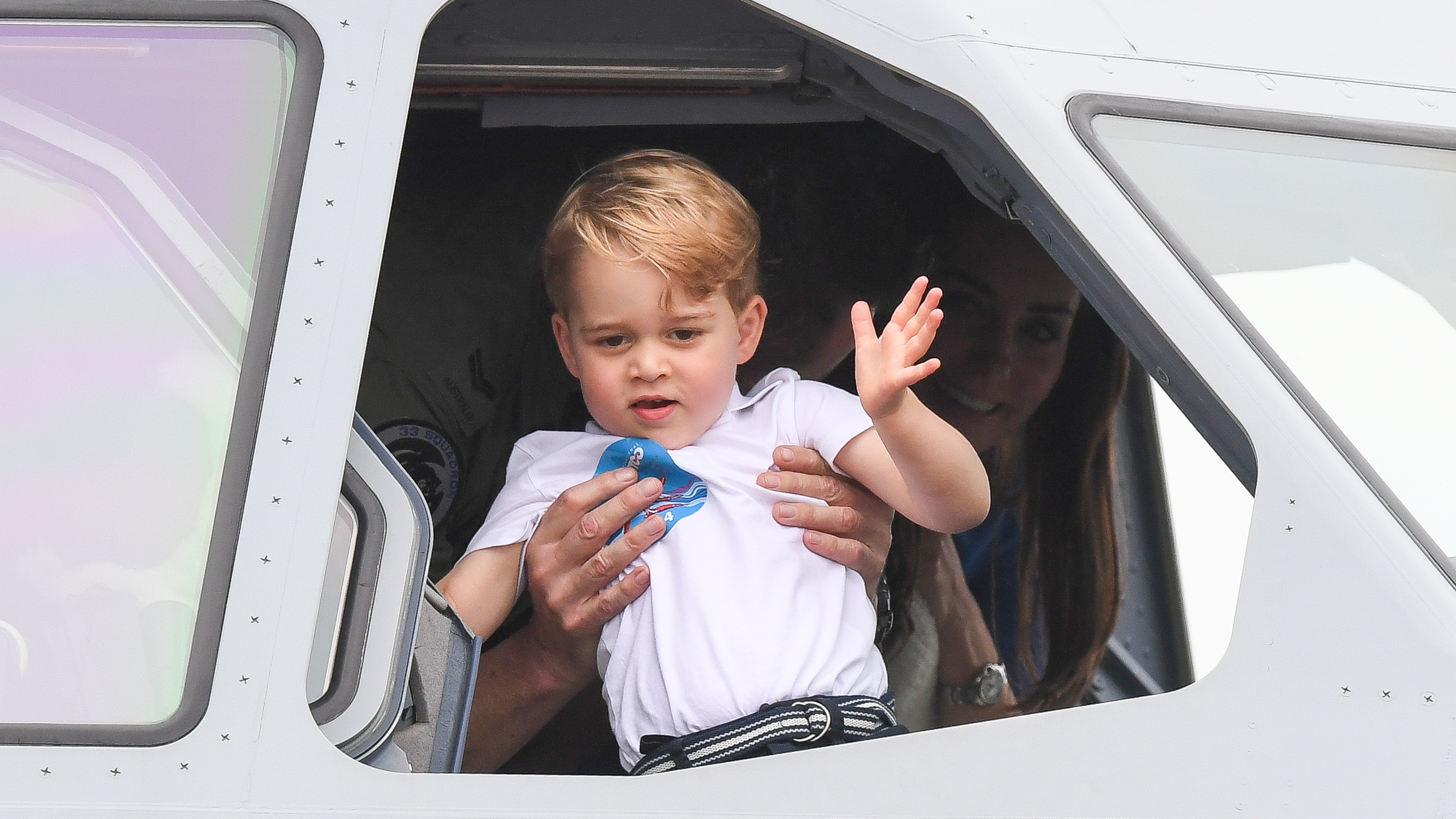 Prince George waves from the cockpit of a plane as he attends the The Royal International Air Tattoo at RAF Fairford on July 8, 2016
