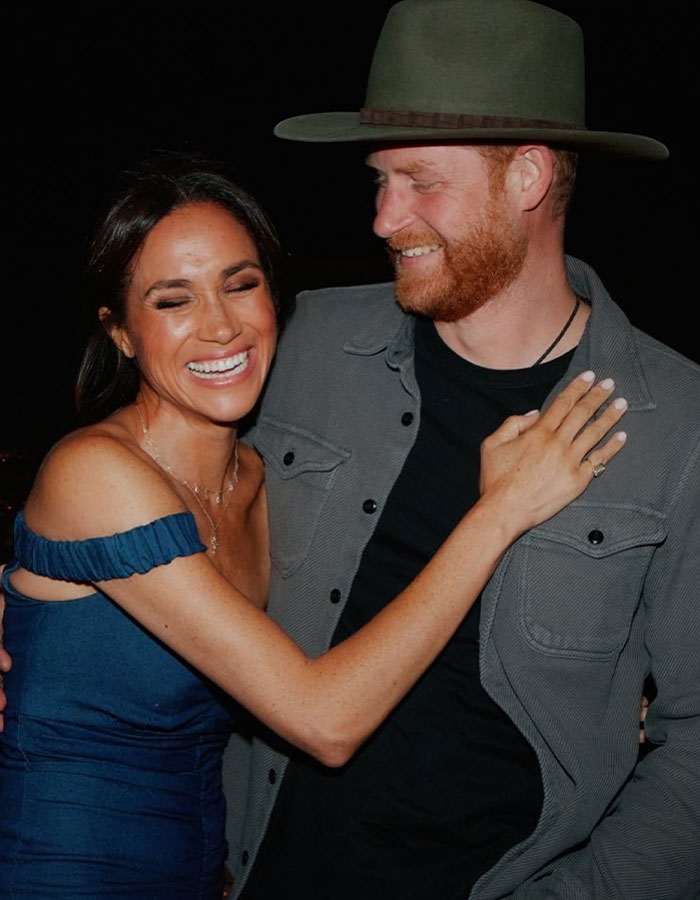 Meghan Markle and Prince Harry smiling and embracing, unrelated to crying or clash details with Kate Middleton. Meghan Markle and Prince Harry smiling and embracing, unrelated to crying or clash details with Kate Middleton.