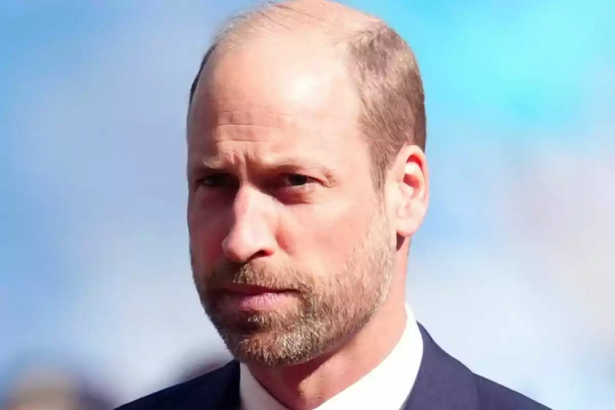 Close-up of a serious Prince William in a blue suit