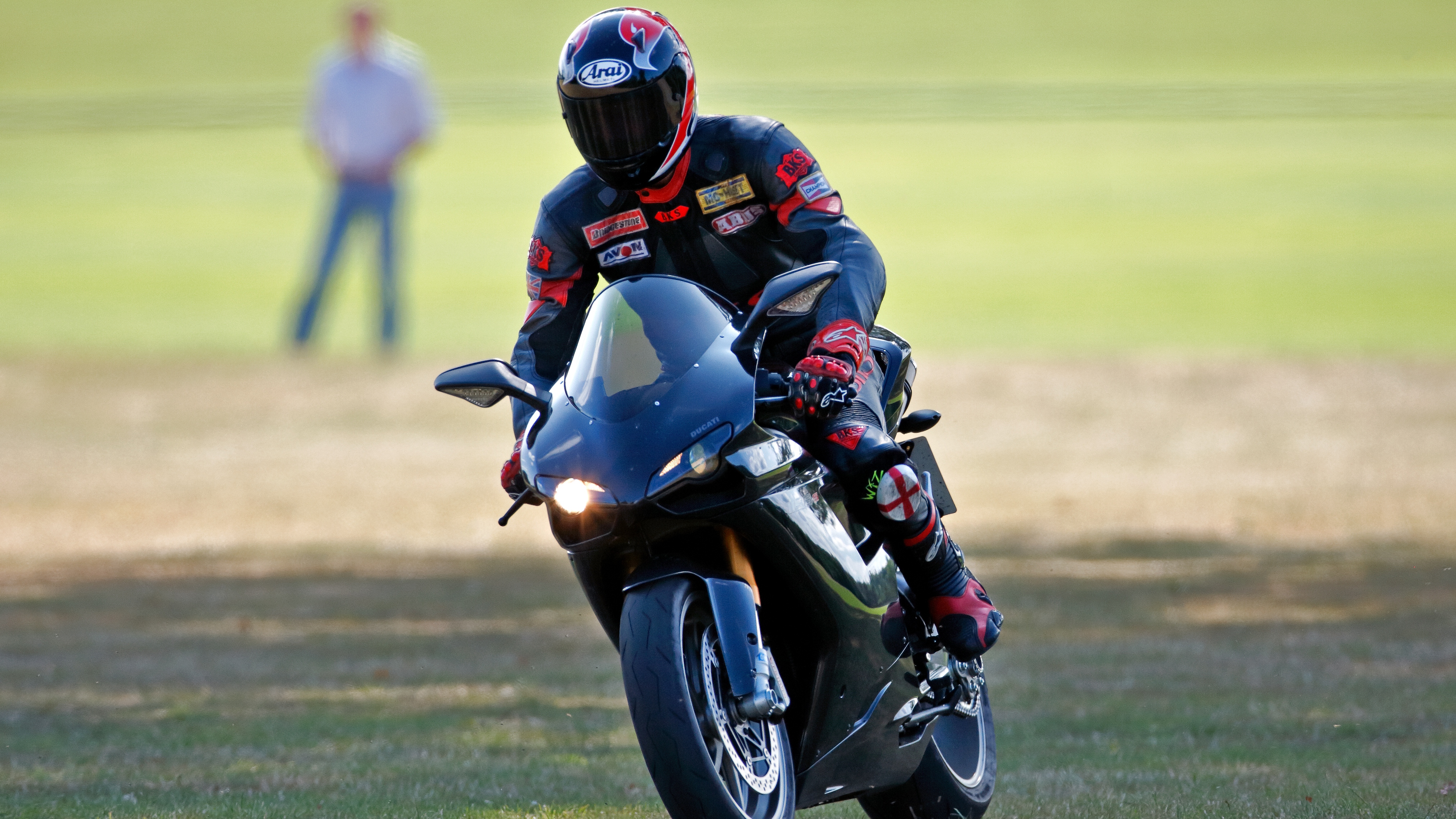 Prince William departs, riding his Ducati 1198S motorbike, after playing in the Westbury Shield charity polo match in 2009