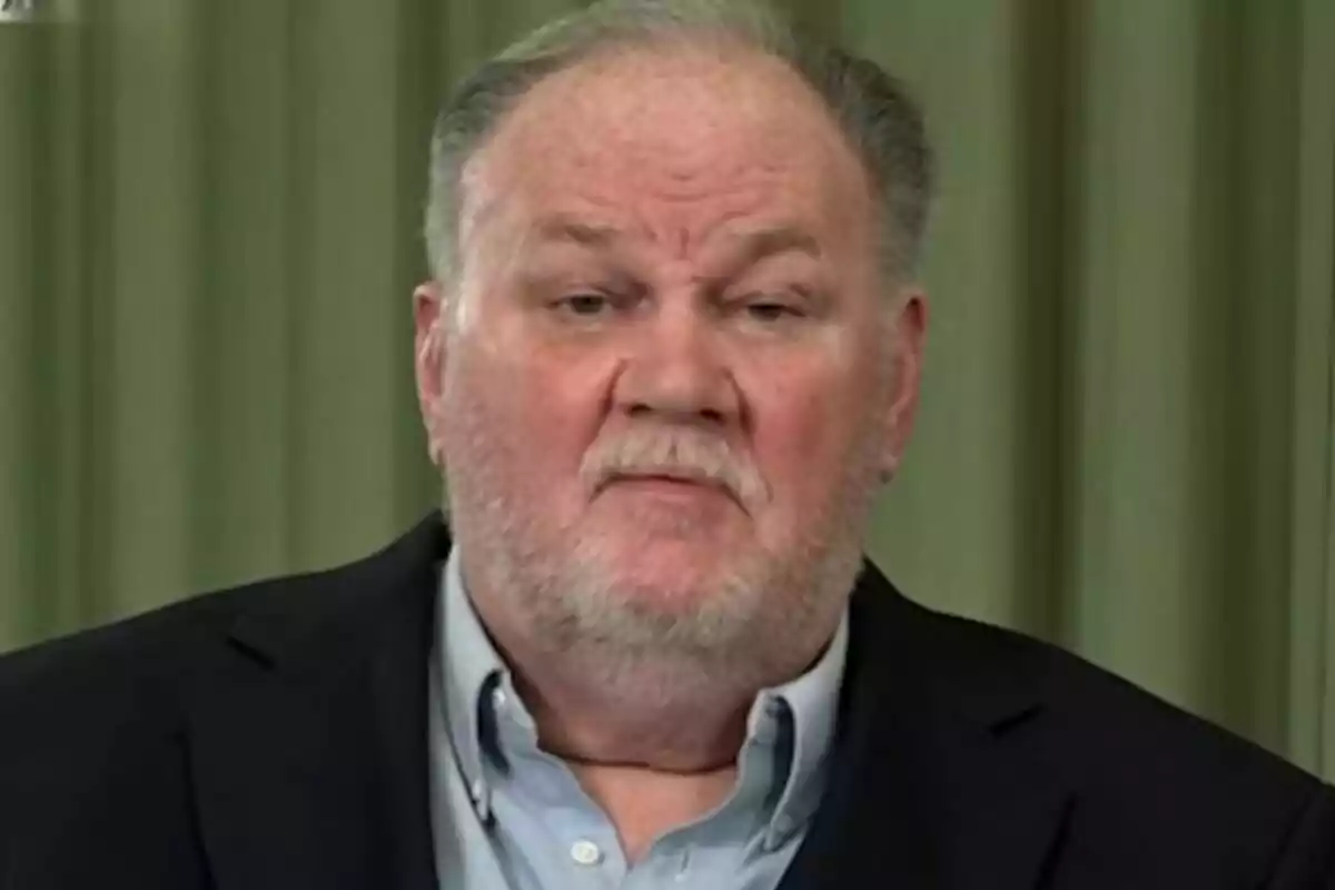 Thomas Markle, wearing a blue jersey and dark jacket, against a background of green curtains. Thomas Markle, wearing a blue jersey and dark jacket, against a background of green curtains.