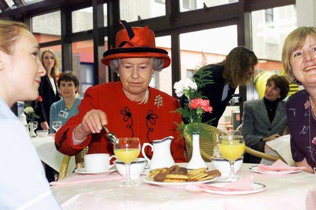 Queen Elizabeth II eating