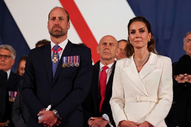 William and Kate stand to listen to the King's speech 