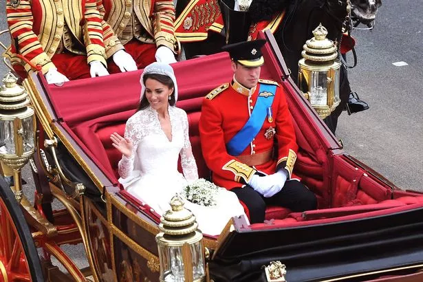 rince William, Duke of Cambridge and Catherine, Duchess of Cambridge journey by carriage procession to Buckingham Palace 
