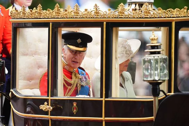 King Charles and Queen Camilla in a carriage