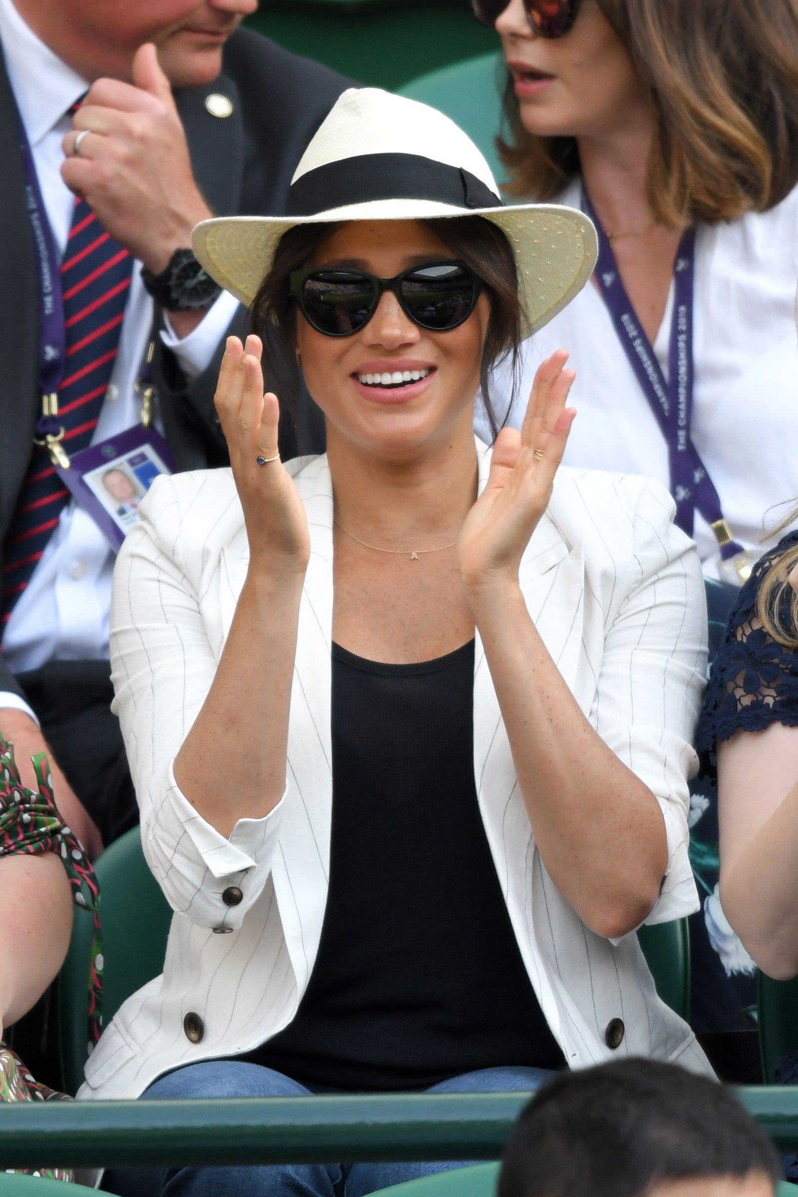 Image may contain Meghan Duchess of Sussex Clothing Hat Accessories Glasses Sunglasses Adult Person and Jewelry