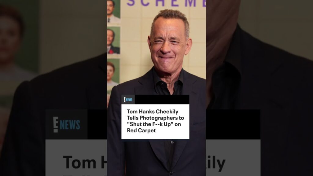 Tom Hanks cheekily tells photographers to shut up at the "The Phoenician Scheme" New York premiere.