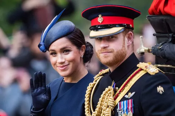 LONDON, ENGLAND - JUNE 08: Prince Harry, Duke of Sussex and Meghan, Duchess of Sussex ride by carriage down the Mall during Trooping The Colour, the Queen's annual birthday parade, on June 08, 2019 in London, England. (Photo by Samir Hussein/Samir Hussein/WireImage)