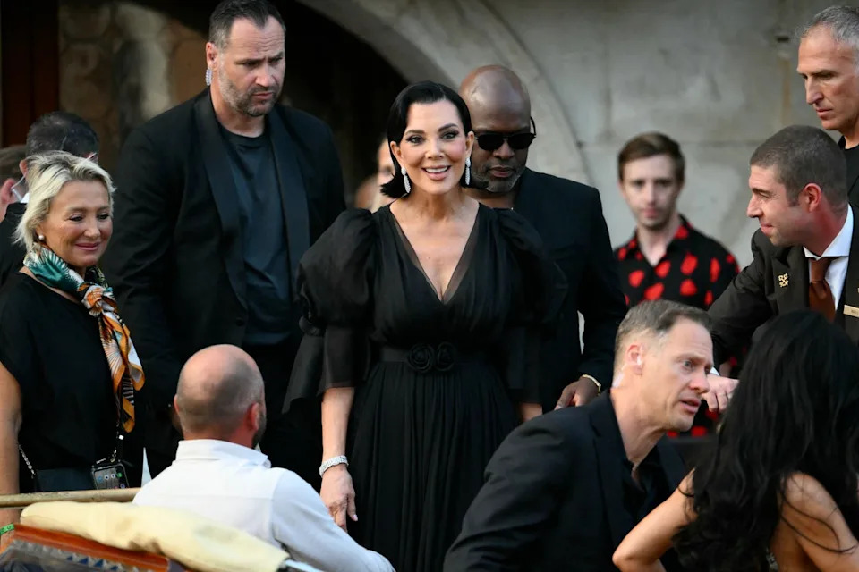 Kris Jenner left the Gritti Palace Hotel in Venice on Thursday in a black dress with puffy sleeves, paired with dangly diamond earrings. However, the V-neck dress seemed a bit too casual for the glamorous affair that she was attending (AFP via Getty Images)