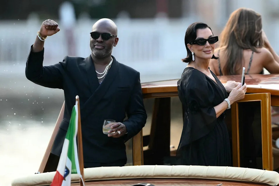The ‘momager’ was seen smiling on the boat with her longtime partner Corey Gamble, who wore an all black suit and silver chains (AFP via Getty Images)