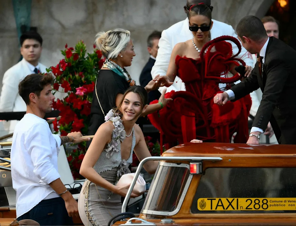 Indian businesswoman Natasha Poonawalla wore  a look that quite literally stood out. Her red corset dress was adorned with multiple giant hearts for the occasion (AFP via Getty Images)