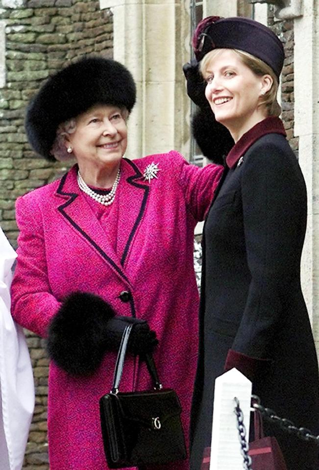 Queen Elizabeth II adjusting Sophie, Countess of Wessex's hat.