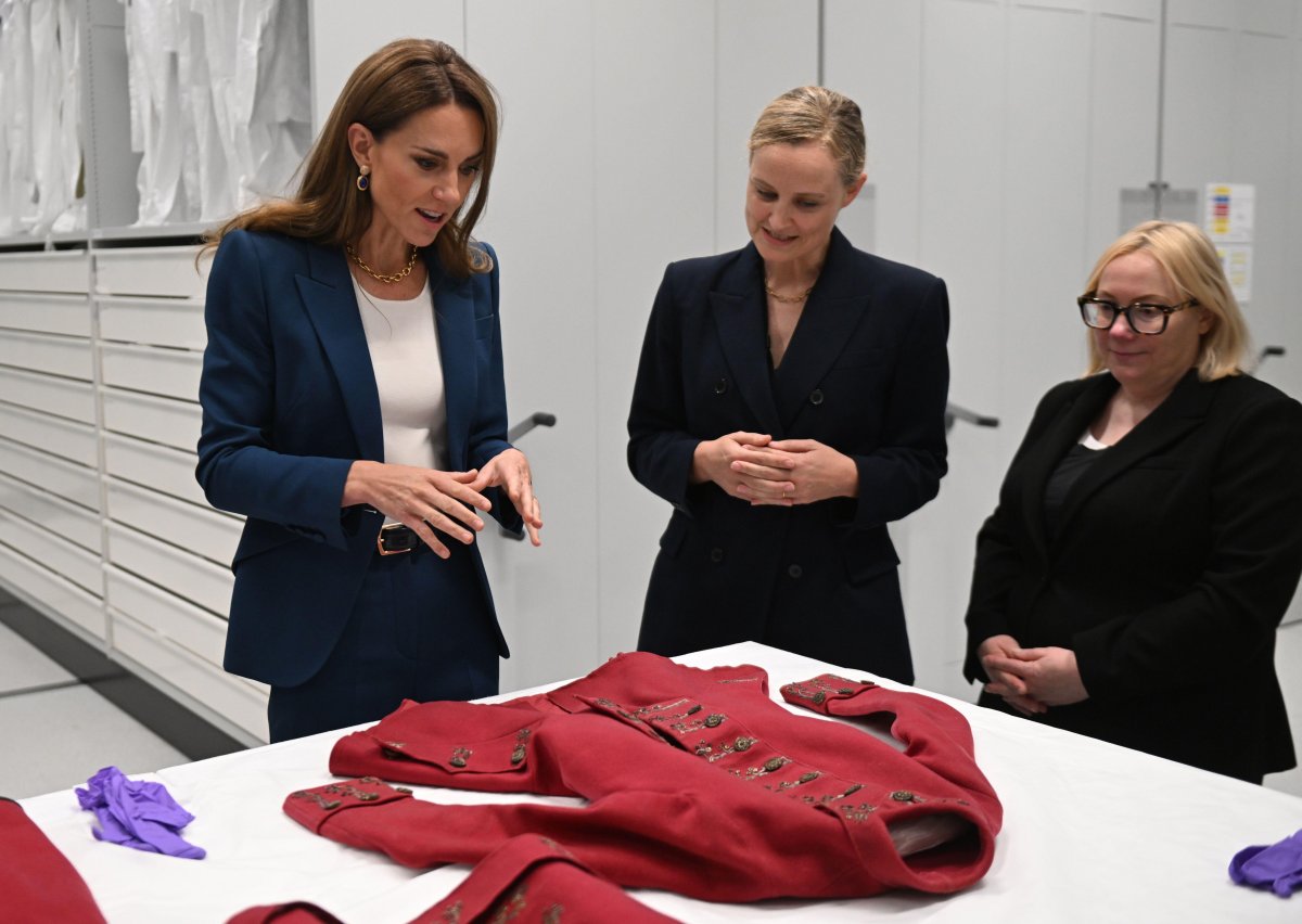 The Princess of Wales, with Oriole Cullen, the Senior Fashion and Textiles Curator, and Kate Parsons, the Director of Collections Care and Access, visits the V&A East Storehouse in east London on June 10, 2025 (Eddie Mulholland/PA Images/Alamy)