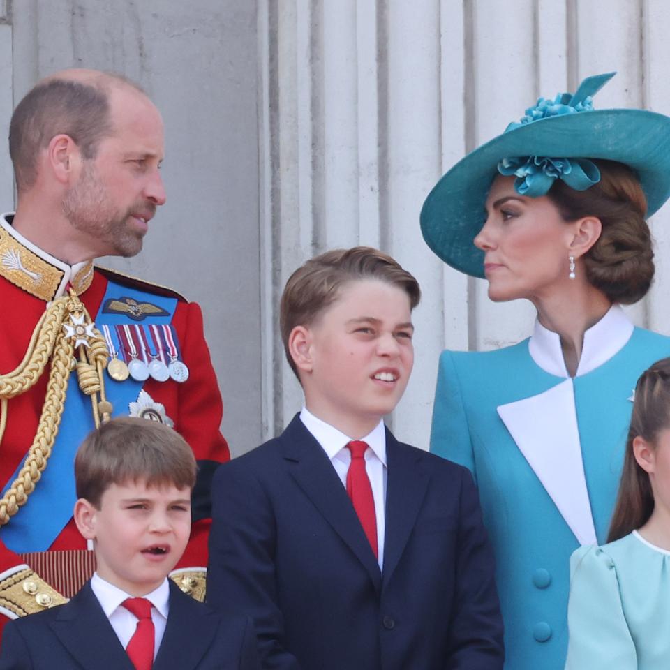 Kate Middleton and Prince William talking on the Buckingham Palace balcony at Trooping the Colour.