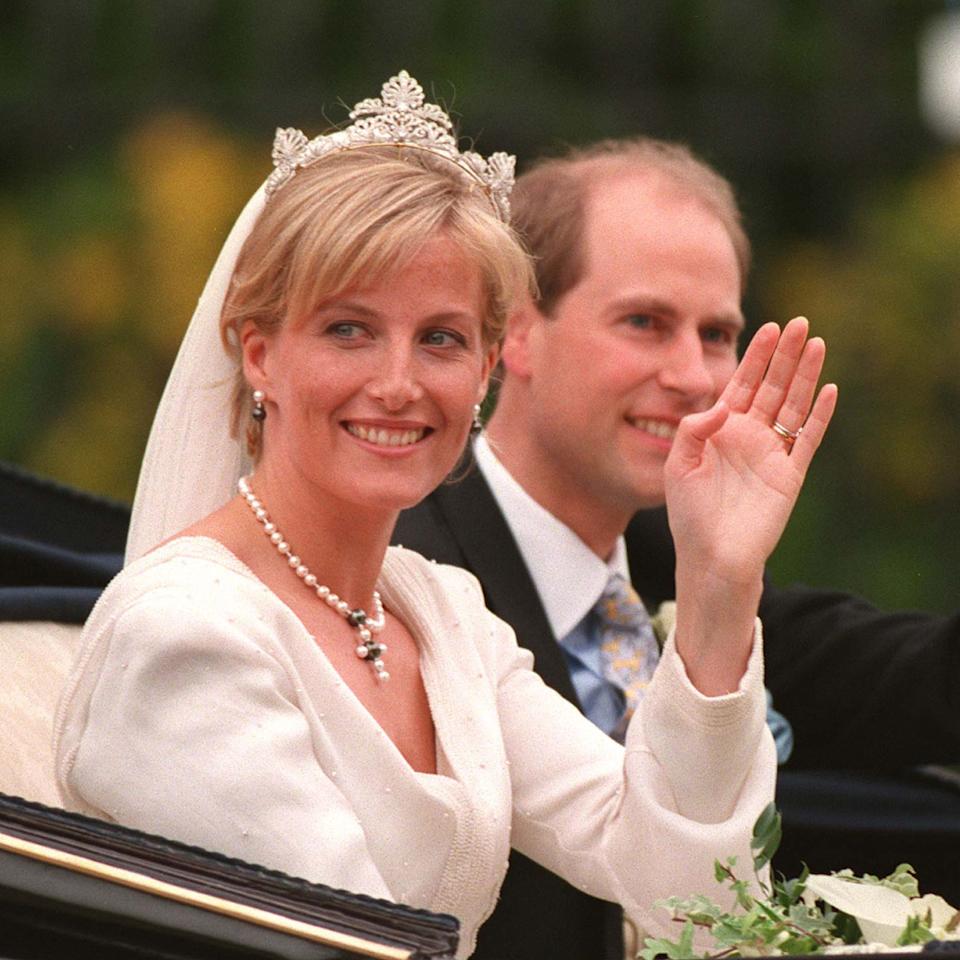 Duchess Sophie and Edward on their wedding day waving in a carriage.