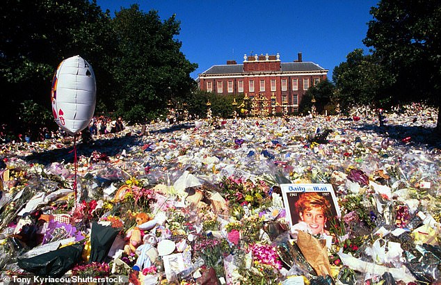 1997: Thousands of tributes form a 'sea of flowers' outside Kensington Palace's Golden Gates following Diana's death