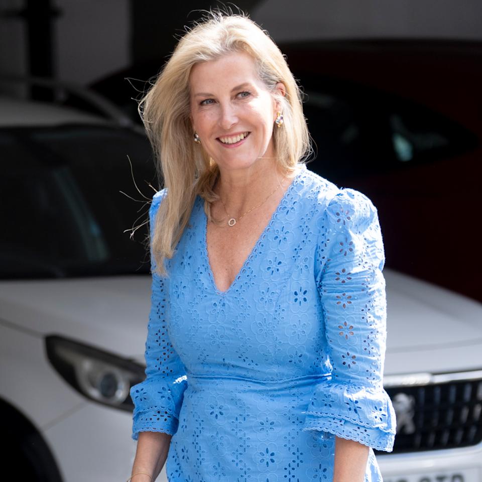  Duchess Sophie wearing a blue eyelet dress smiling. 